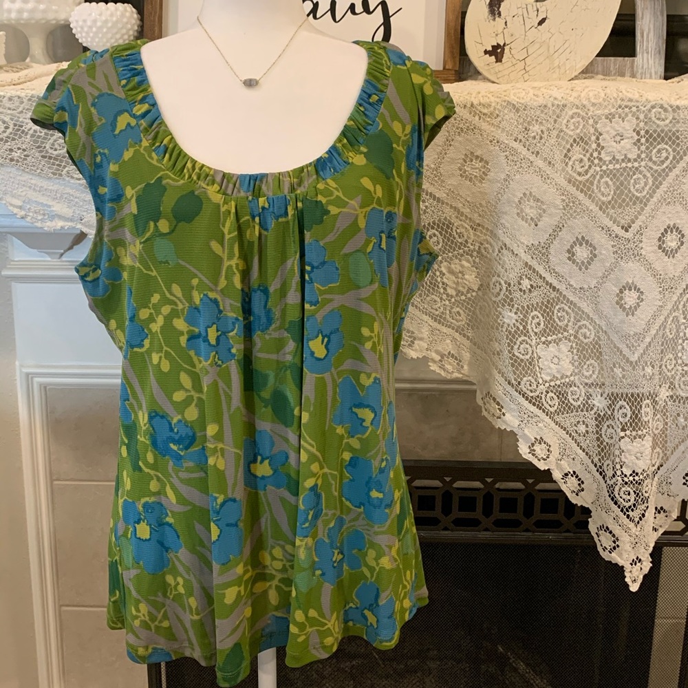 Cap sleeve top with unique detail at neck